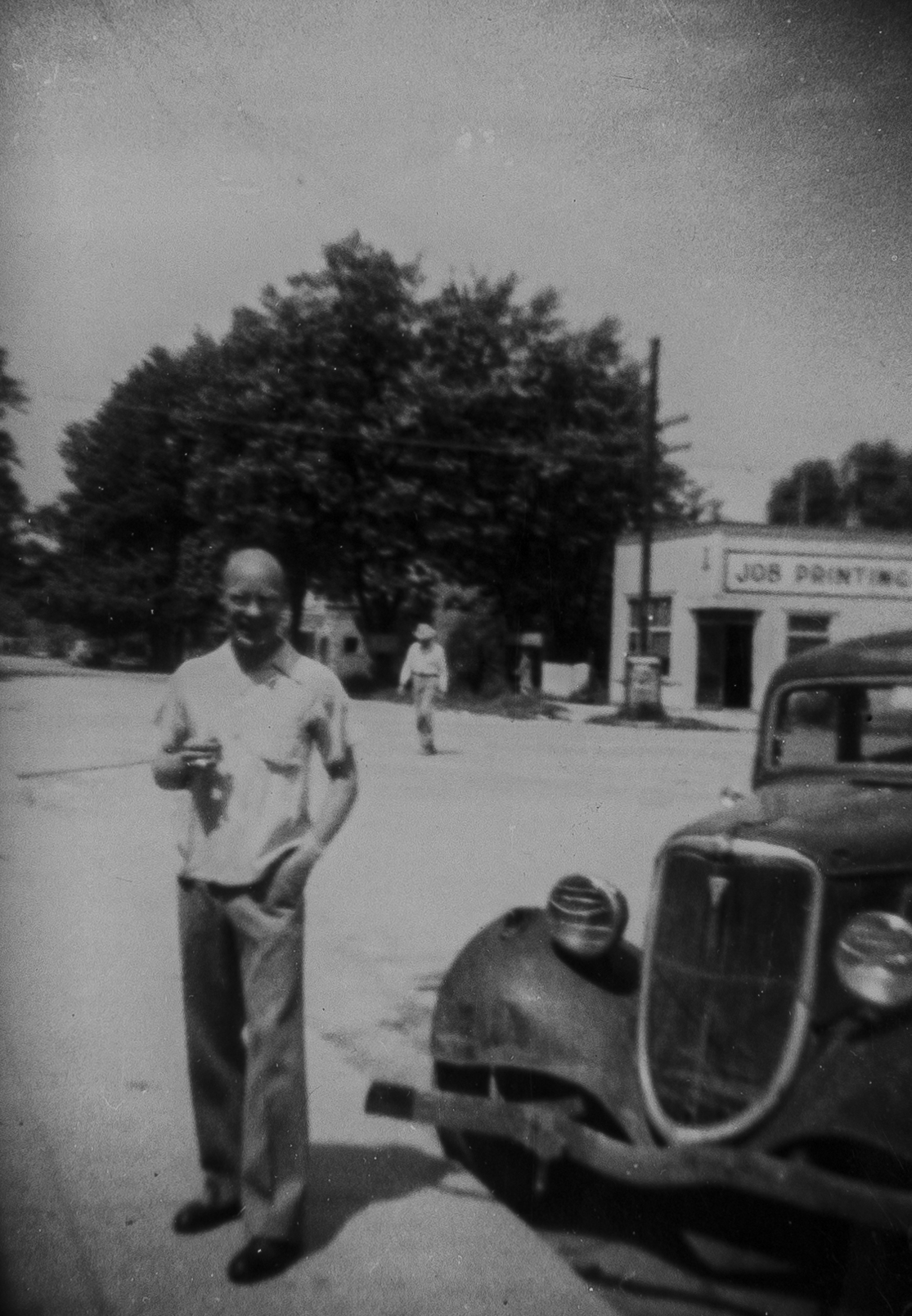 Swede Boice in front of Automobile